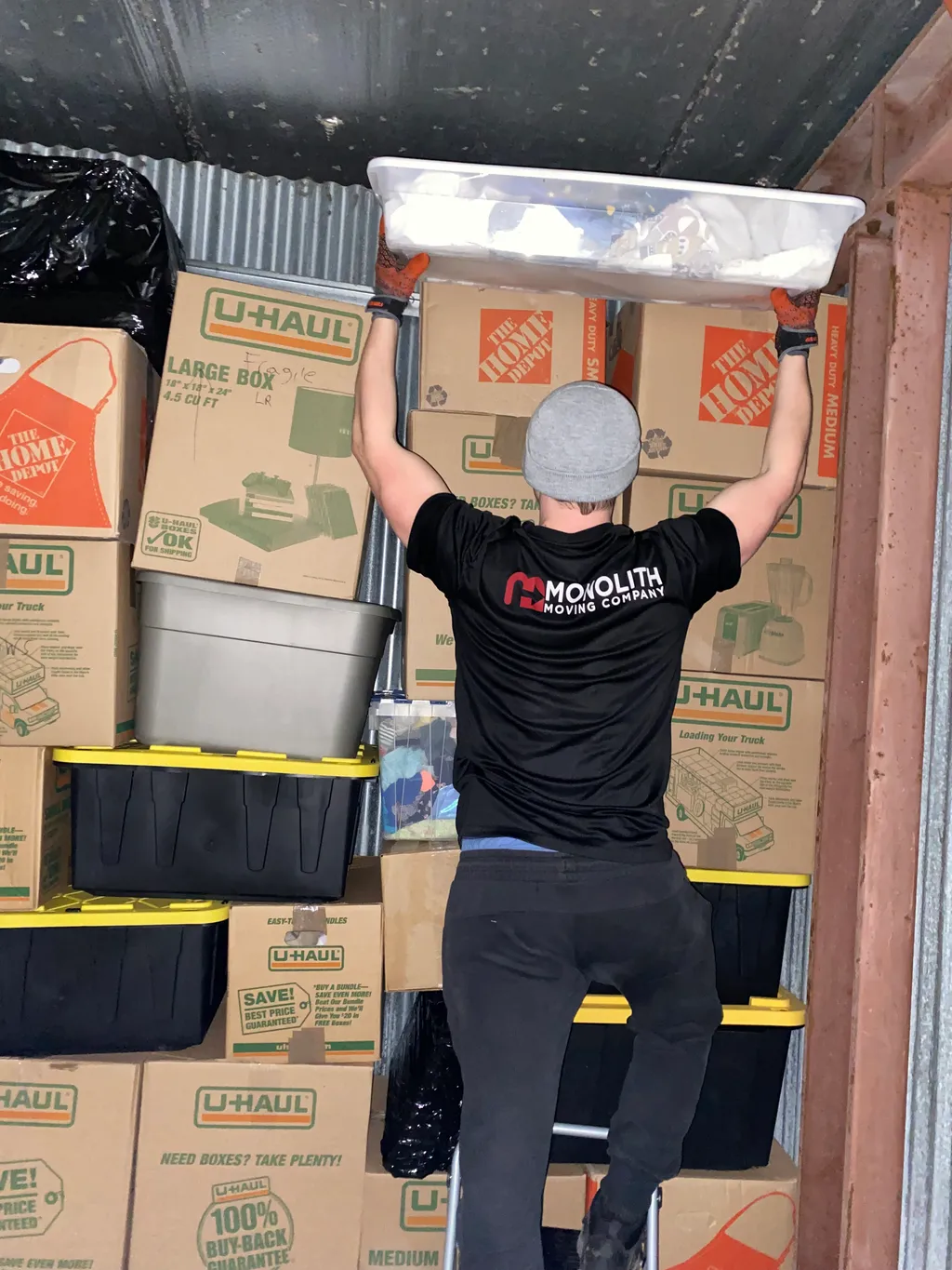 Monolith Moving Company crew loading furniture into an apartment building near Main St, Downers Grove